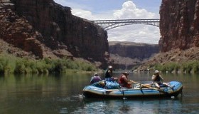 Team Weatherbee floating under Navaho Bridge